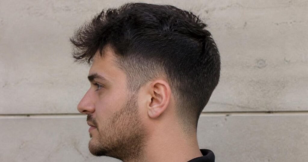 Close-up of an overgrown skin fade haircut with a softened, blurred fade line in need of a touch-up